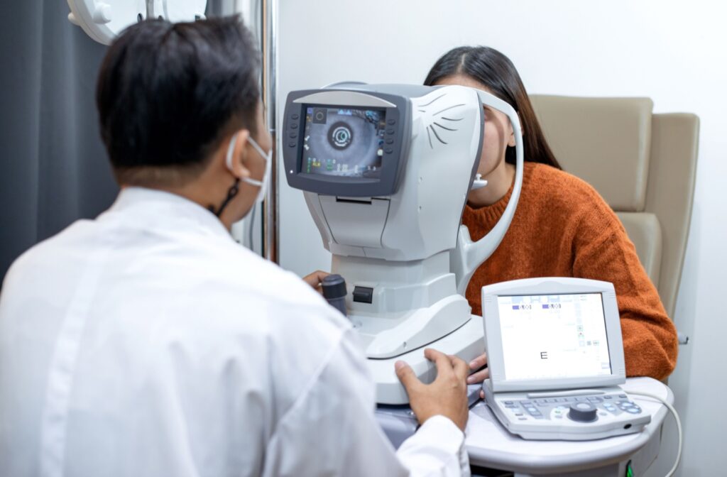 A woman undergoing an eye exam using advanced technology